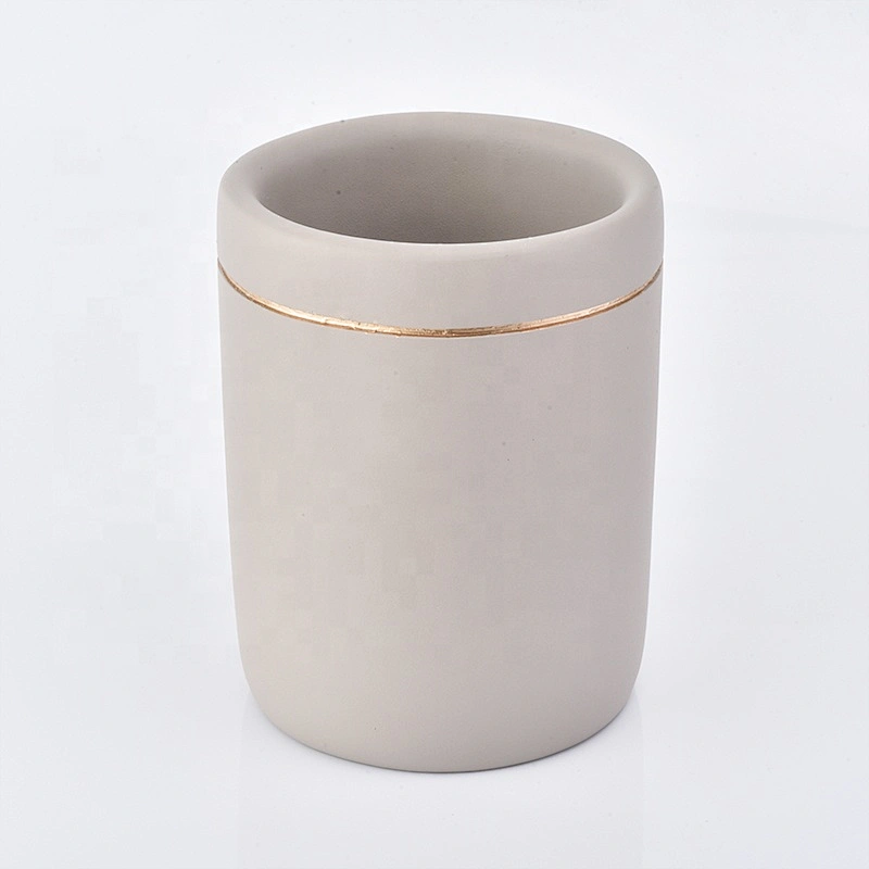 grey concrete bath room accessories with lotion bottles dispenser toothbrush holder