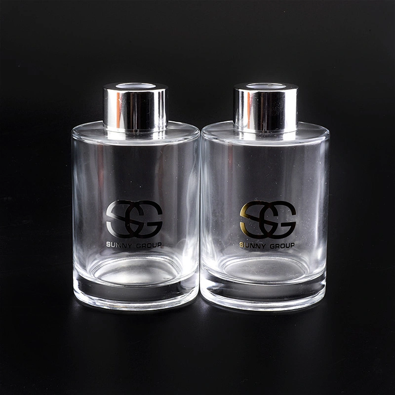 Transparent cylinder decal golden paper glass perfume bottles