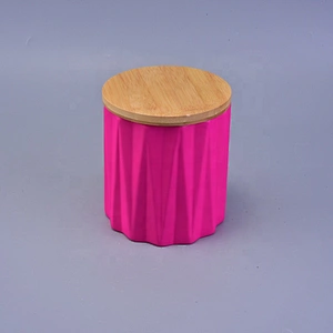 Matte iridescent ceramic candle holder with wood lid