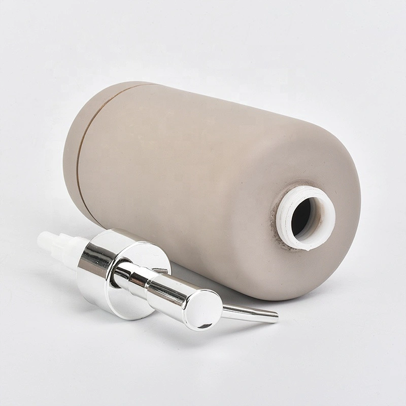 grey concrete bath room accessories with lotion bottles dispenser toothbrush holder