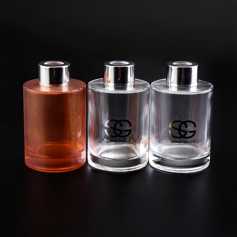 Transparent cylinder decal golden paper glass perfume bottles