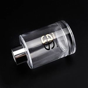 Transparent cylinder decal golden paper glass perfume bottles