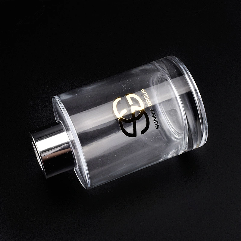 Transparent cylinder decal golden paper glass perfume bottles