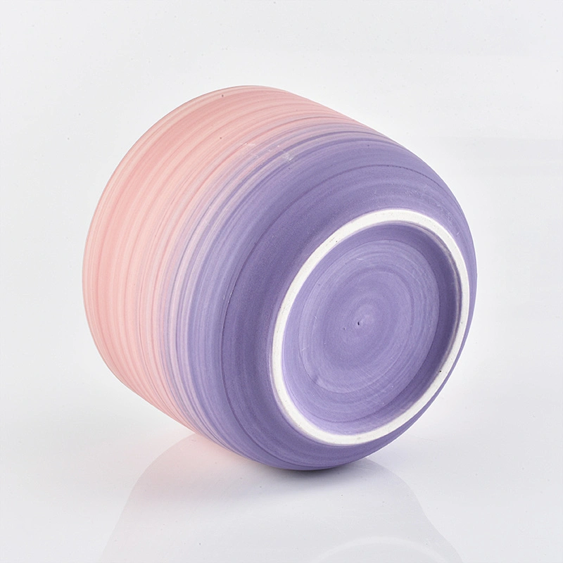 multiple color ceramic candle vessels with glazing decorations