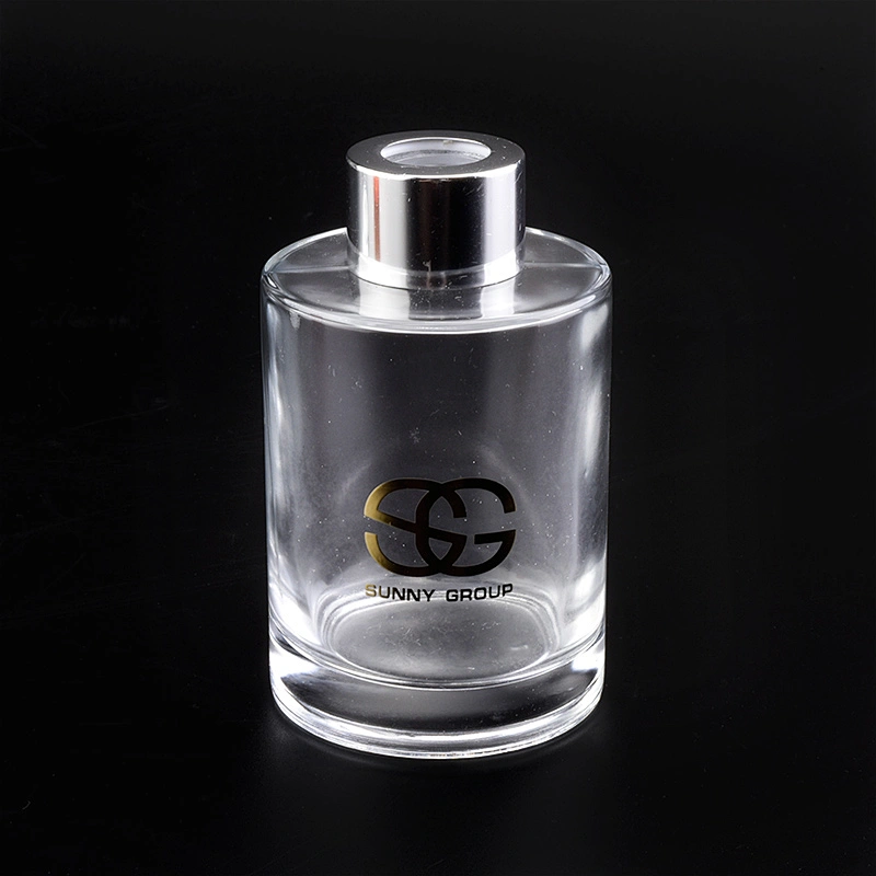 Transparent cylinder decal golden paper glass perfume bottles