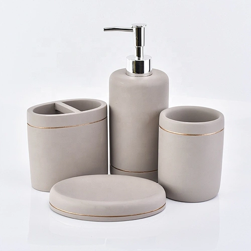 grey concrete bath room accessories with lotion bottles dispenser toothbrush holder