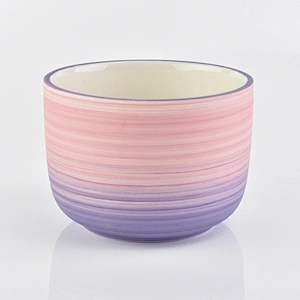 multiple color ceramic candle vessels with glazing decorations