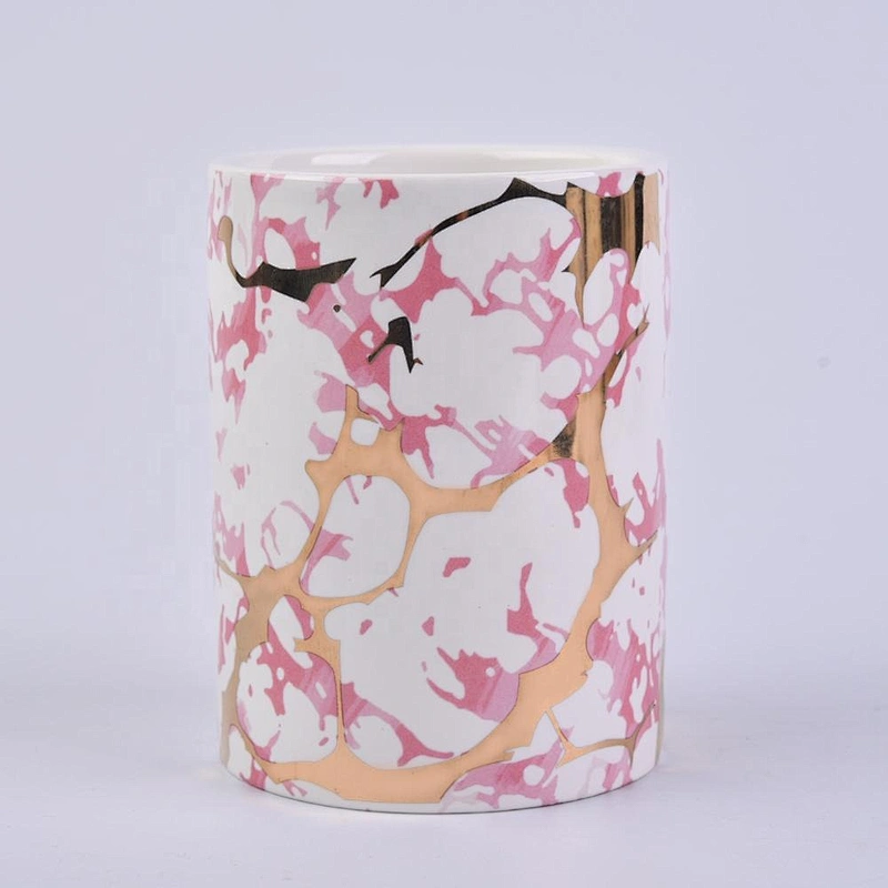 straight ceramic candle jars with gold marble patterns