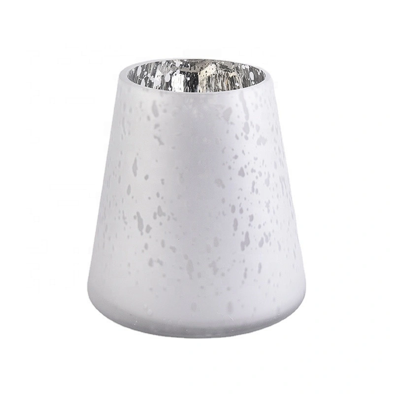 Large white glass candle vessels with mercury decorations