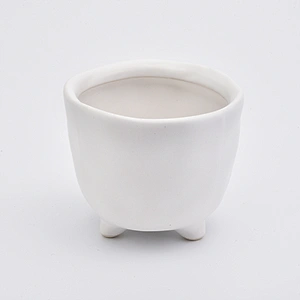 Footed matte white ceramic vessel candle jars in bulk