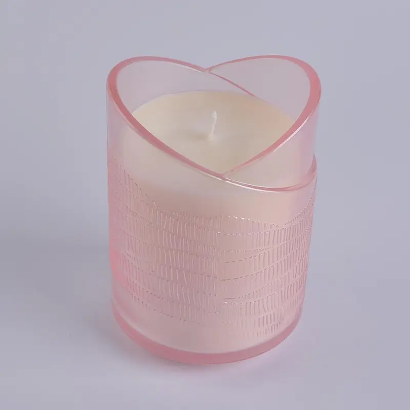 translucent pink glass candle holder in heart shape