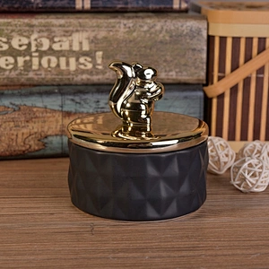 Unique black ceramic candle holder with gold lid for home decor
