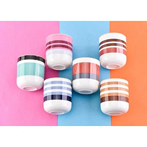 glossy ceramic candle jars with colorful stripes