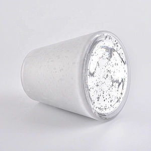 Large white glass candle vessels with mercury decorations