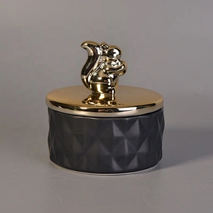 Unique black ceramic candle holder with gold lid for home decor