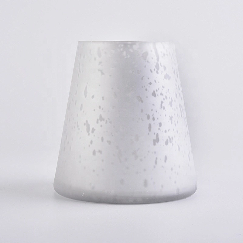 Large white glass candle vessels with mercury decorations