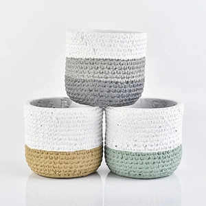 Matte white amber concrete candle jars with woven designs