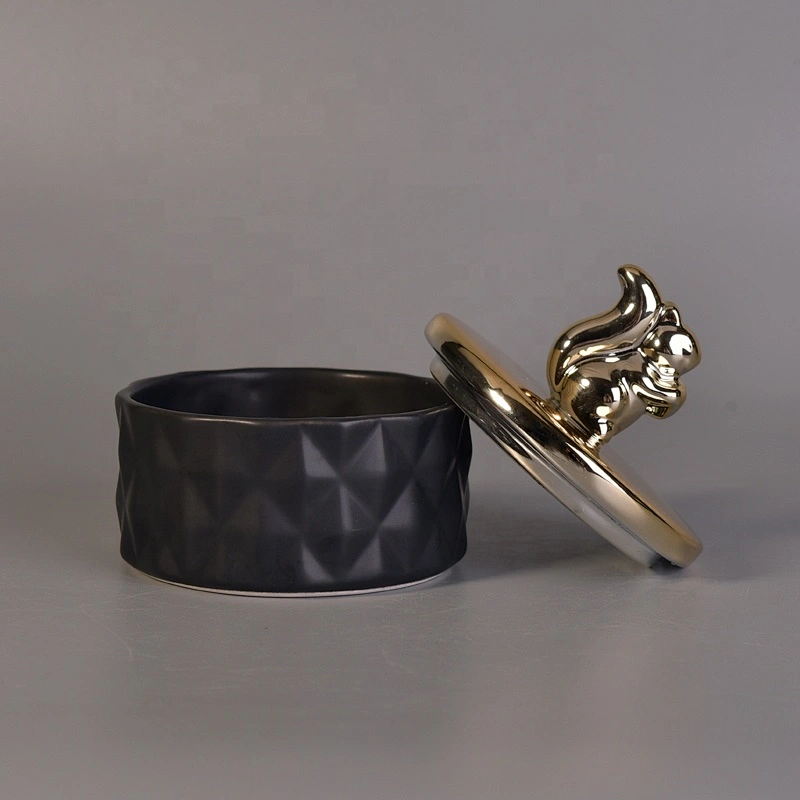 Unique black ceramic candle holder with gold lid for home decor