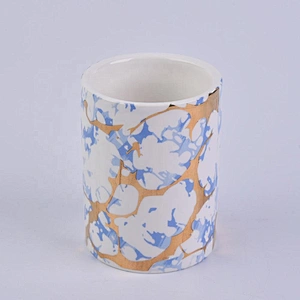 straight ceramic candle jars with gold marble patterns