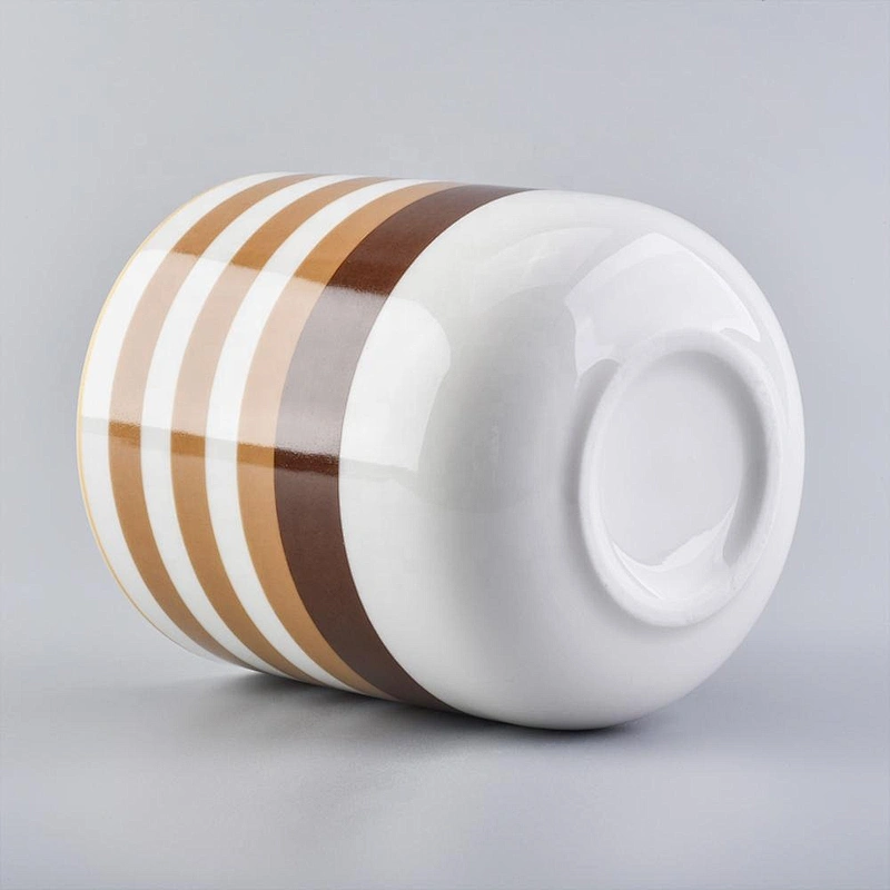 glossy ceramic candle jars with colorful stripes