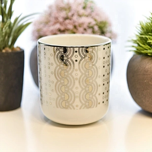 glossy white ceramic candle jars with gold printing