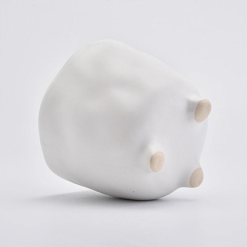 Footed matte white ceramic vessel candle jars in bulk