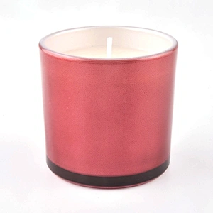 Small glass candle jars with spraying colors