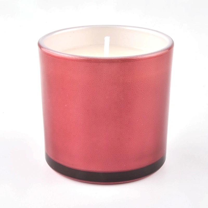 Small glass candle jars with spraying colors