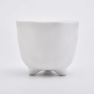 Footed matte white ceramic vessel candle jars in bulk