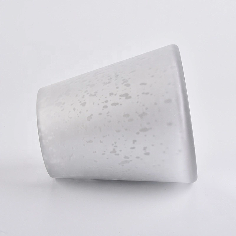 Large white glass candle vessels with mercury decorations
