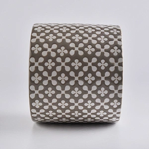 brown ceramic candle holder, round ceramic vessel with patterns
