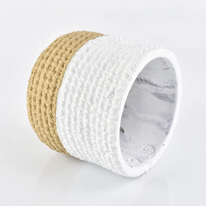 Matte white amber concrete candle jars with woven designs