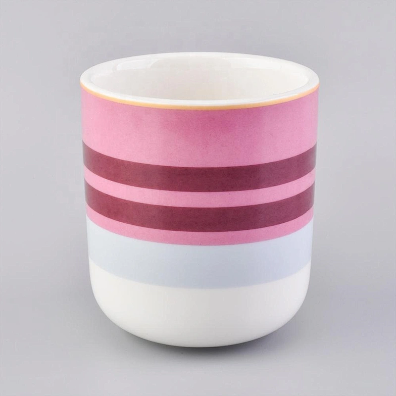 glossy ceramic candle jars with colorful stripes