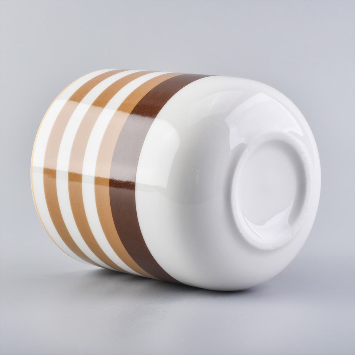 glossy ceramic candle jars with colorful stripes