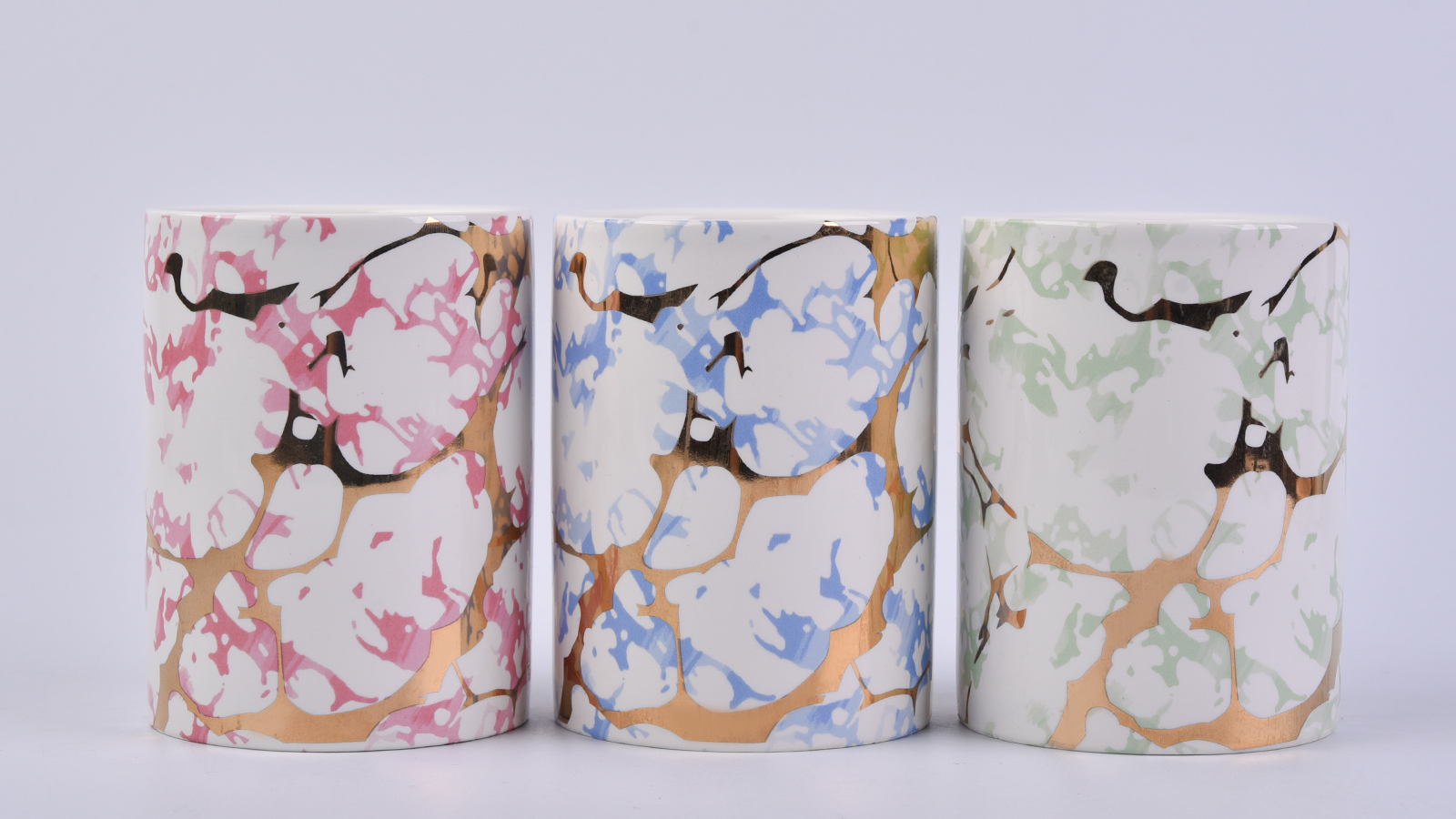 straight ceramic candle jars wtih gold marble patterns