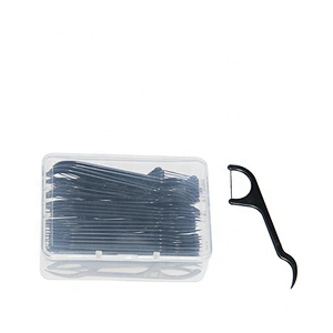 charcoal floss picks in dental floss box