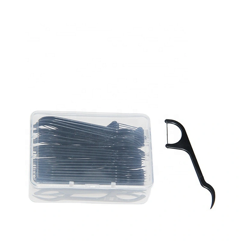 charcoal floss picks in dental floss box