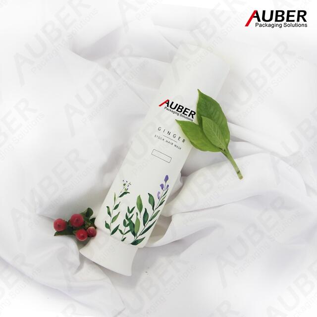 Green leaves plastic squeeze tube with white screw on cap