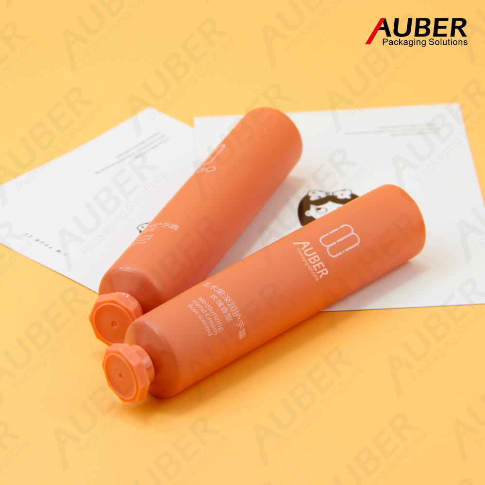 Matte orange PE tubes with octagonal screw caps