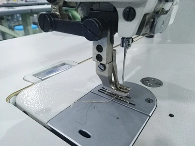 two needle lockstitch sewing machine