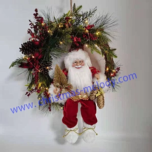 Santa sitting in a garland with lights
