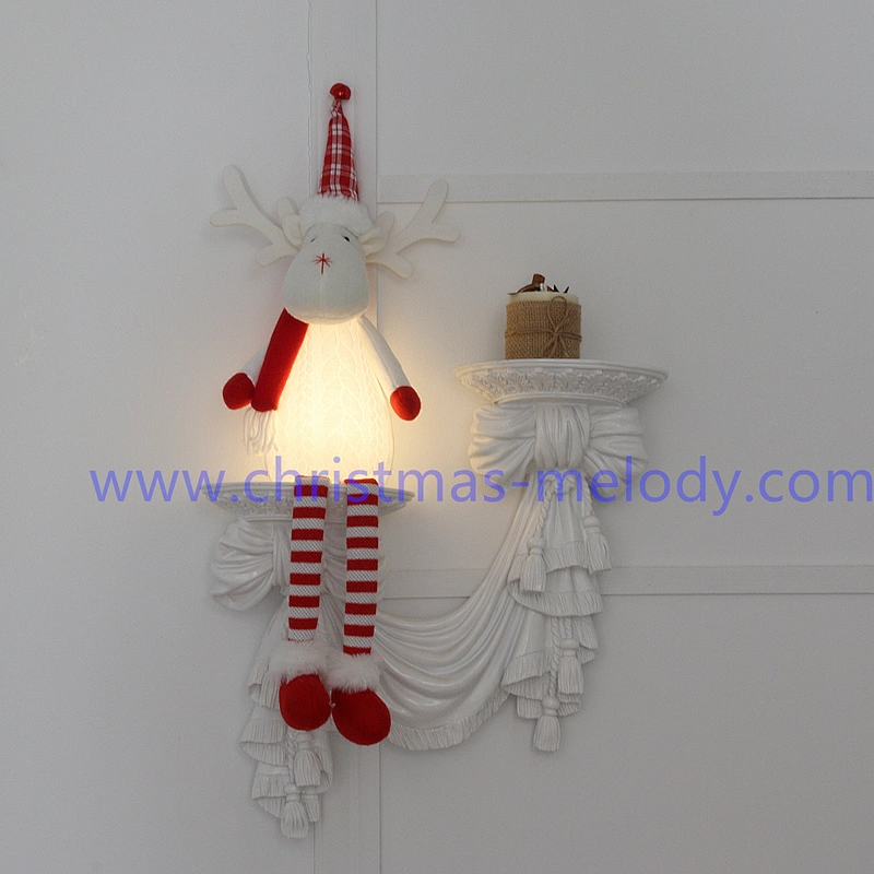 A pair of deer with Christmas lights