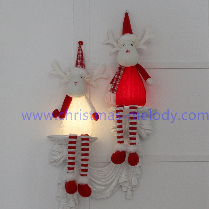 A pair of deer with Christmas lights