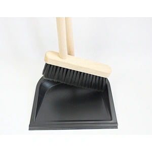 cleaning  metal dustpan with broom