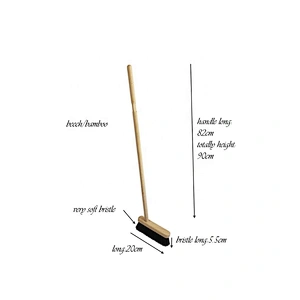 cleaning  metal dustpan with broom