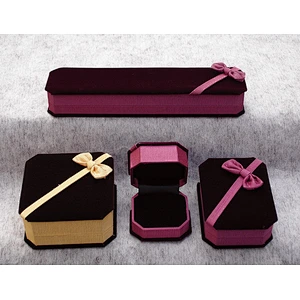 Velvet gift box in polygonal shape with bowknot on top for jewelry.