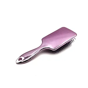 Oval detangling hair brush with elastic pins in hair extensions for long black hair