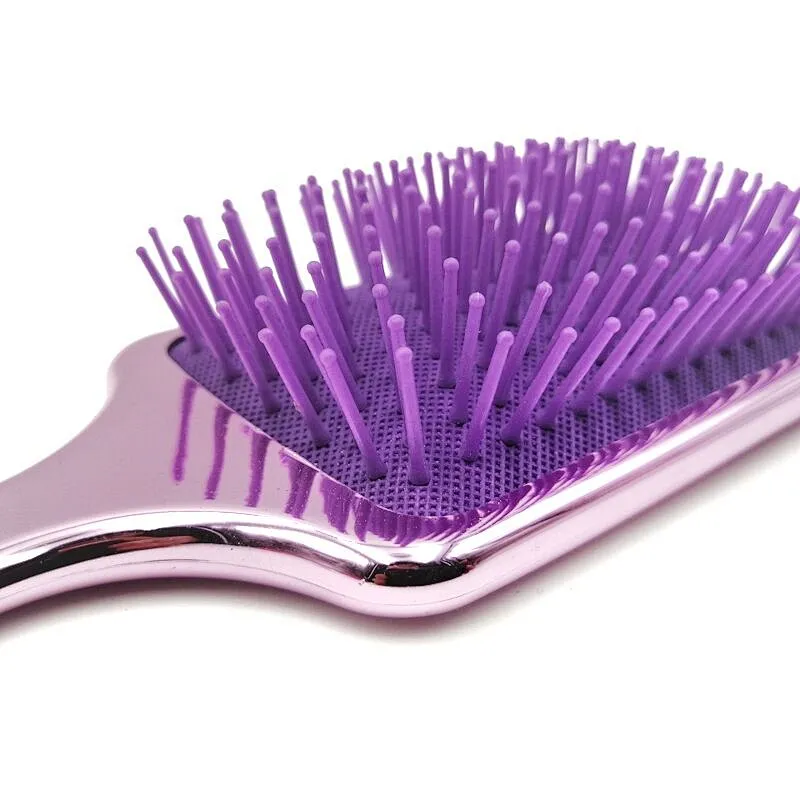 Oval detangling hair brush with elastic pins in hair extensions for long black hair
