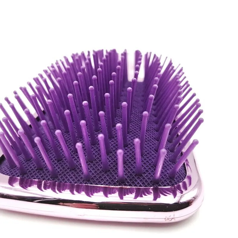 Oval detangling hair brush with elastic pins in hair extensions for long black hair
