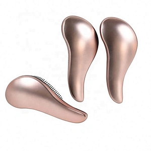 Wholesale popular comfortable OEM logo professional golden pink detangle hairbrush